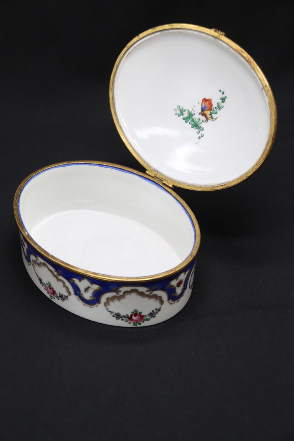 A late 19th century French hand painted porcelain oval box by Samson of Paris View XXI