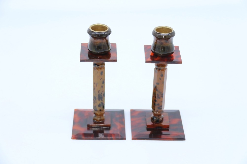 A pair of Art Deco tortoiseshell and clouded butterscotch Bakelite candlesticks View V