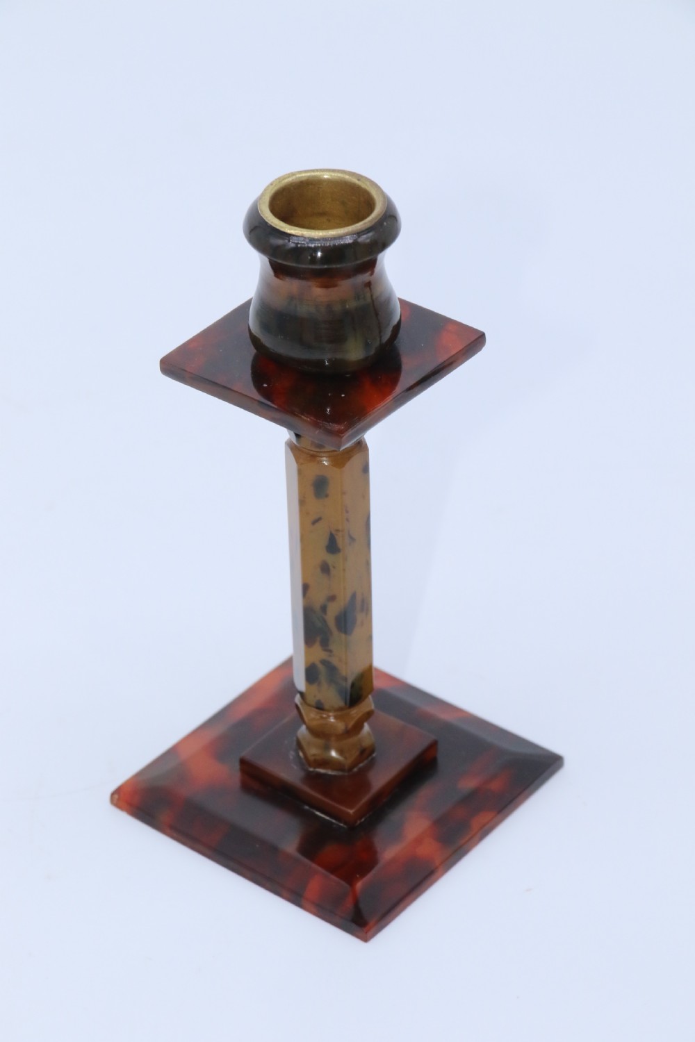 A pair of Art Deco tortoiseshell and clouded butterscotch Bakelite candlesticks View VI