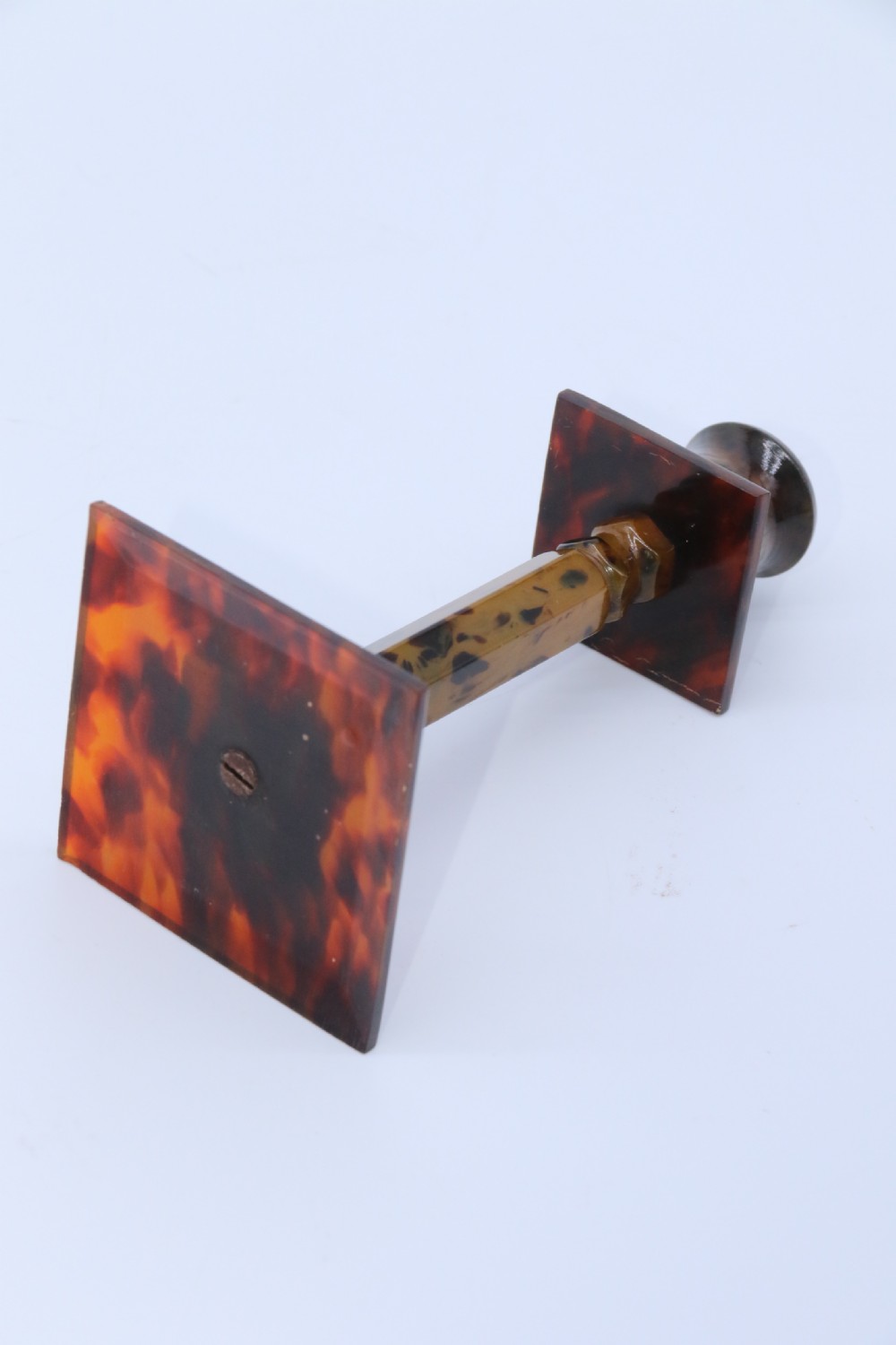 A pair of Art Deco tortoiseshell and clouded butterscotch Bakelite candlesticks View VII