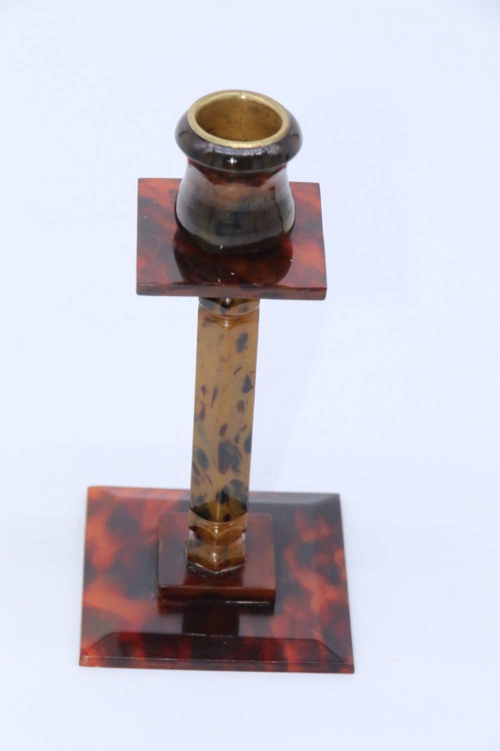 A pair of Art Deco tortoiseshell and clouded butterscotch Bakelite candlesticks View VIII