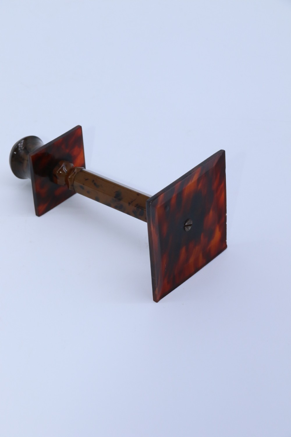 A pair of Art Deco tortoiseshell and clouded butterscotch Bakelite candlesticks View XI