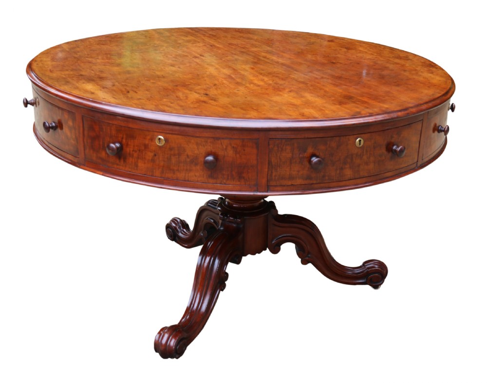 A large high quality mid-19th century figured mahogany library drum table