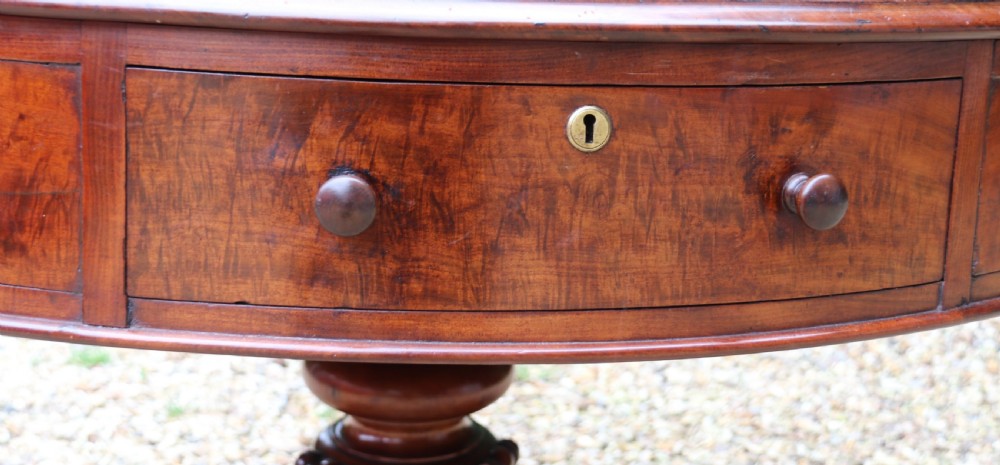 A large high quality mid-19th century figured mahogany library drum table View V