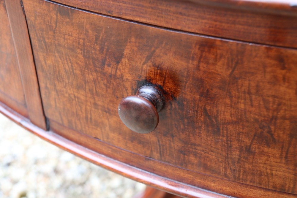A large high quality mid-19th century figured mahogany library drum table View VI