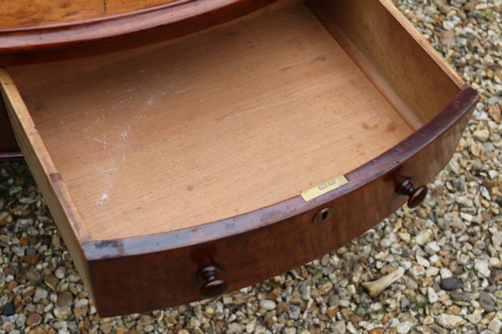 A large high quality mid-19th century figured mahogany library drum table View X