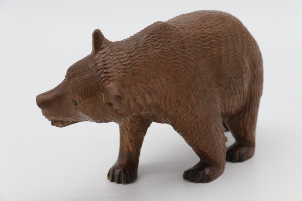 A Swiss Black Forest carved lime wood study of a prowling bear View III
