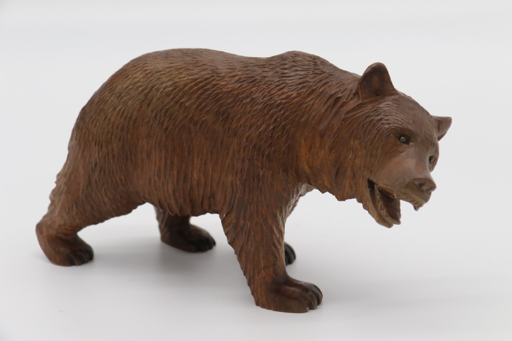 A Swiss Black Forest carved lime wood study of a prowling bear View IX