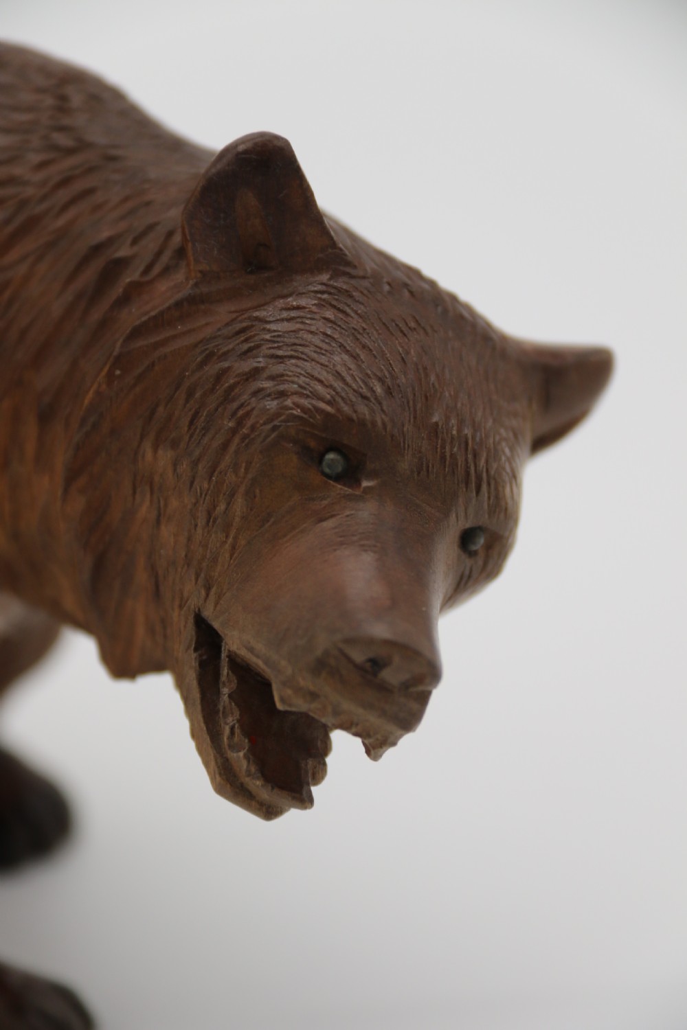 A Swiss Black Forest carved lime wood study of a prowling bear View X