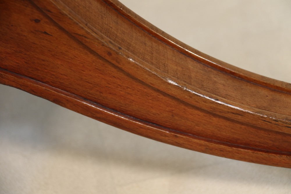 A fully adjustable early 20th C deep buttoned leather upholstered desk chair View XI