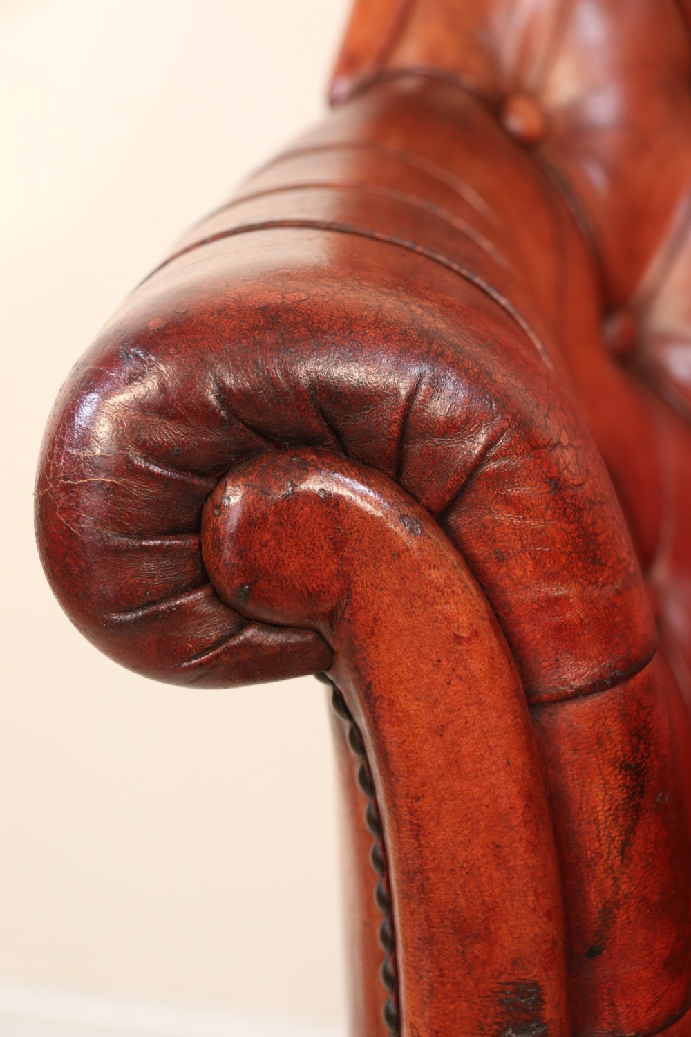 A fully adjustable early 20th C deep buttoned leather upholstered desk chair View XVIII