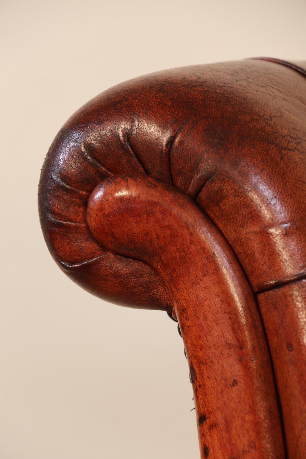 A fully adjustable early 20th C deep buttoned leather upholstered desk chair View XXII