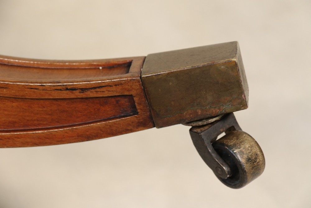 A fully adjustable early 20th C deep buttoned leather upholstered desk chair View XXIII