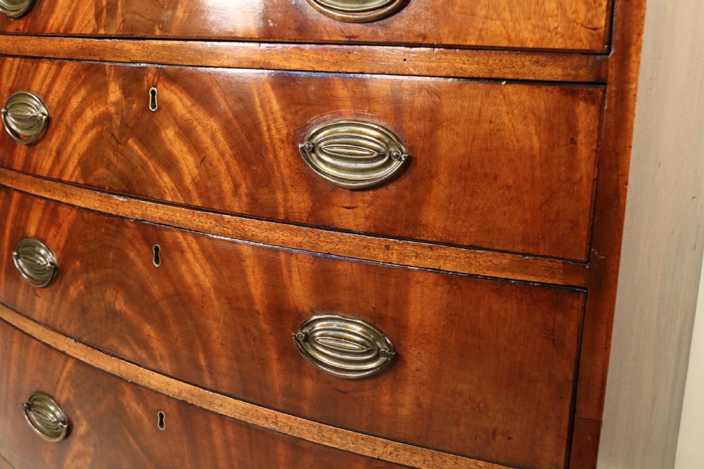 Antique Regency period flame mahogany small bow fronted chest of drawers View VI