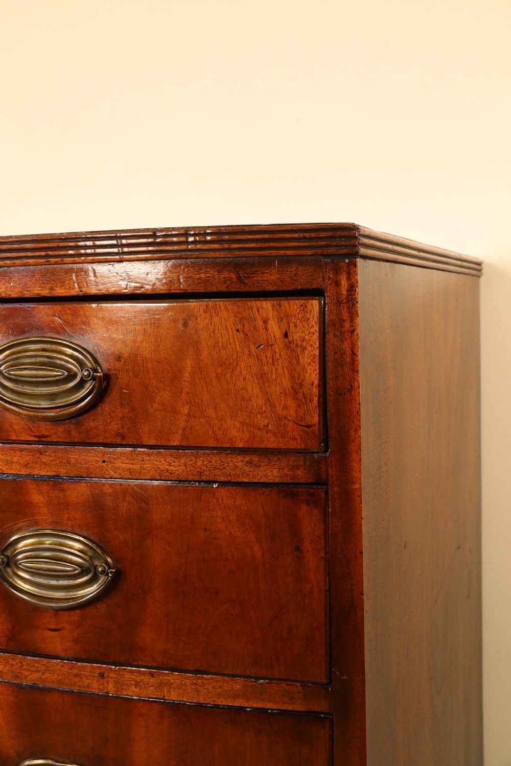 Antique Regency period flame mahogany small bow fronted chest of drawers View VII
