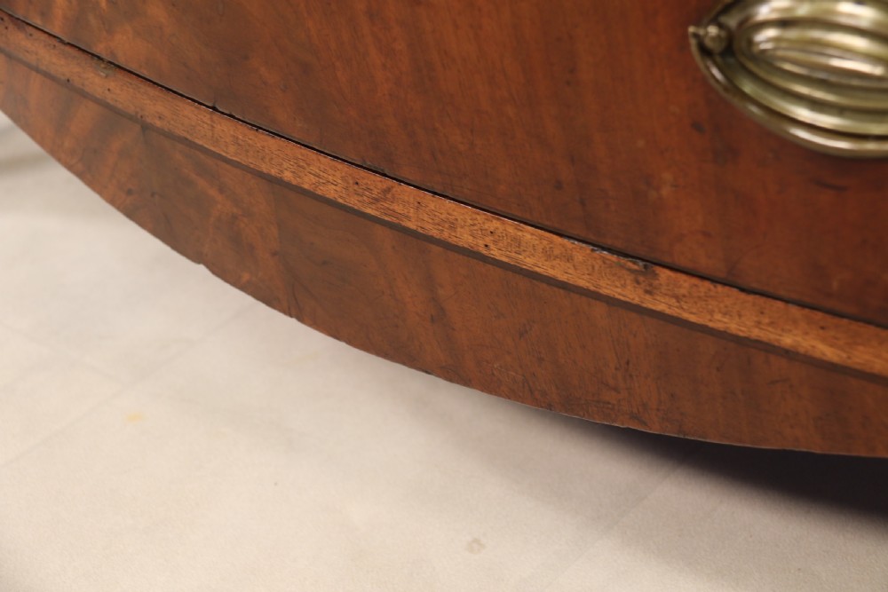 Antique Regency period flame mahogany small bow fronted chest of drawers View IX
