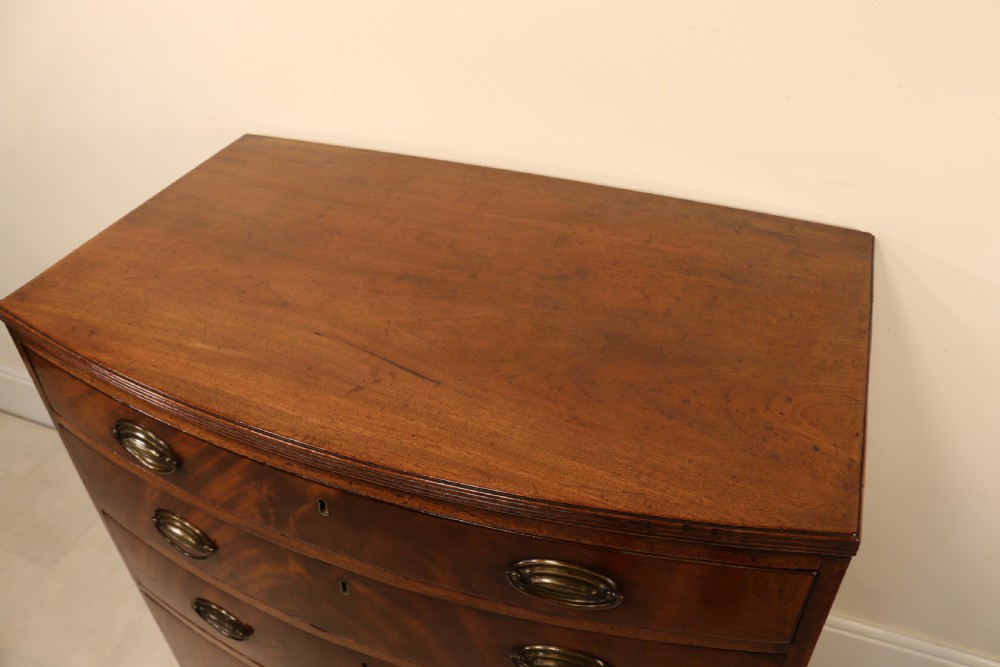 Antique Regency period flame mahogany small bow fronted chest of drawers View X