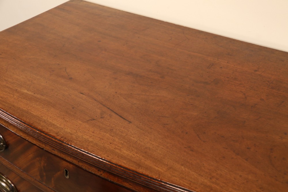 Antique Regency period flame mahogany small bow fronted chest of drawers View XI