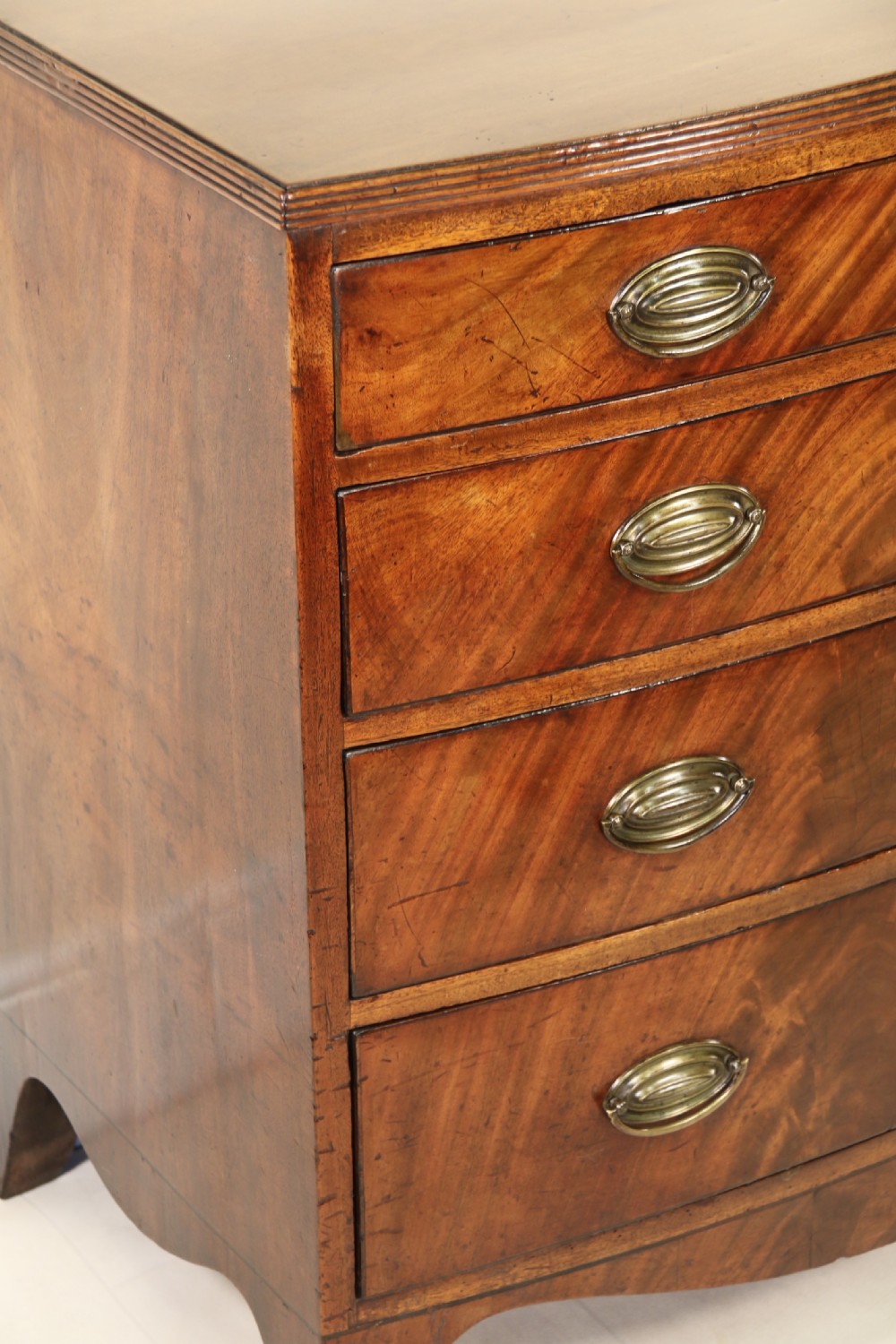 Antique Regency period flame mahogany small bow fronted chest of drawers View XV