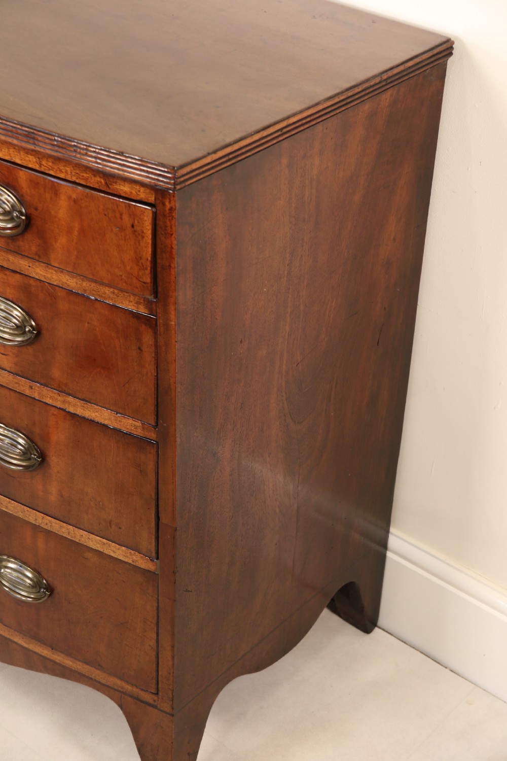 Antique Regency period flame mahogany small bow fronted chest of drawers View XVII