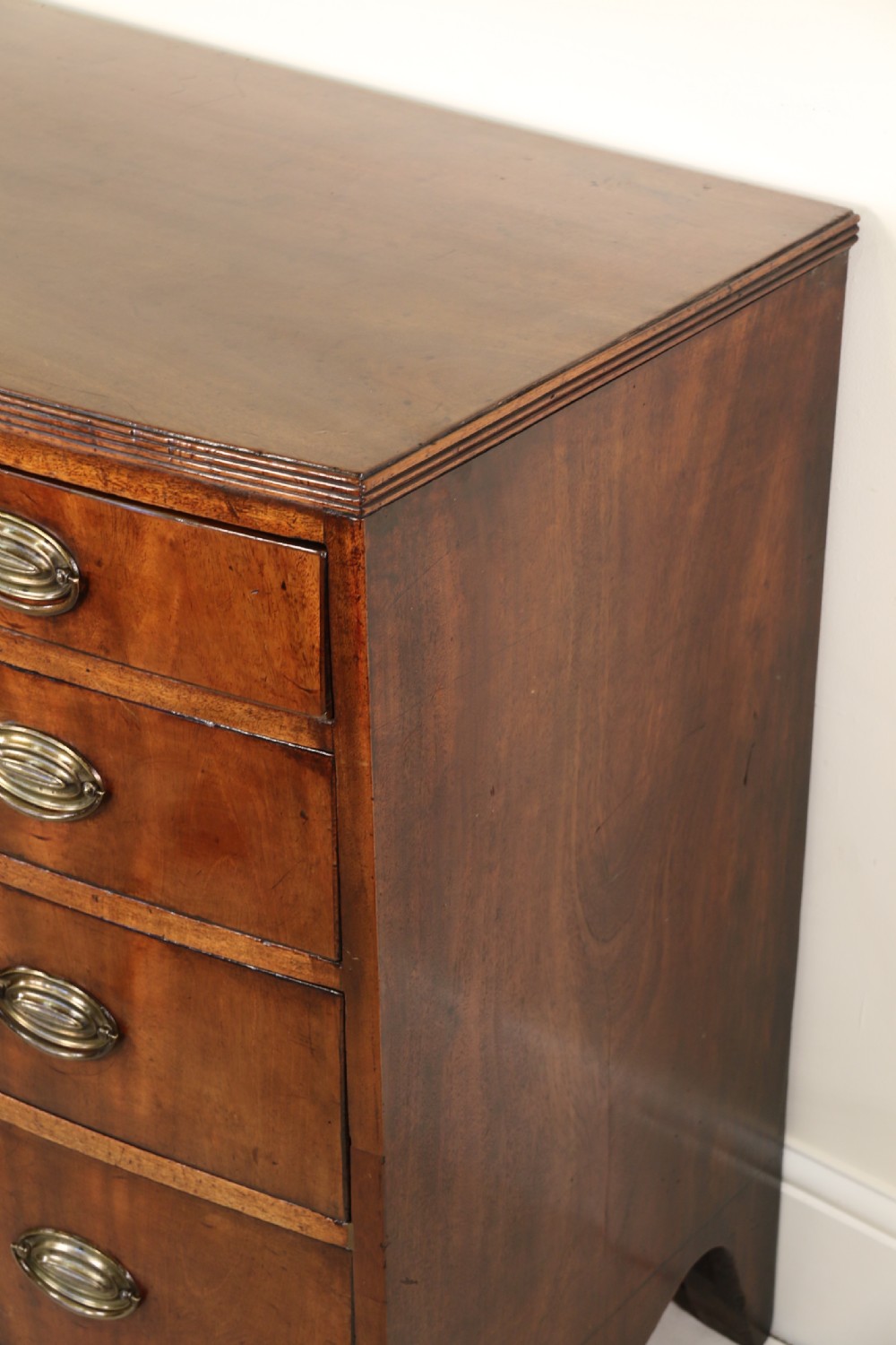 Antique Regency period flame mahogany small bow fronted chest of drawers View XVIII