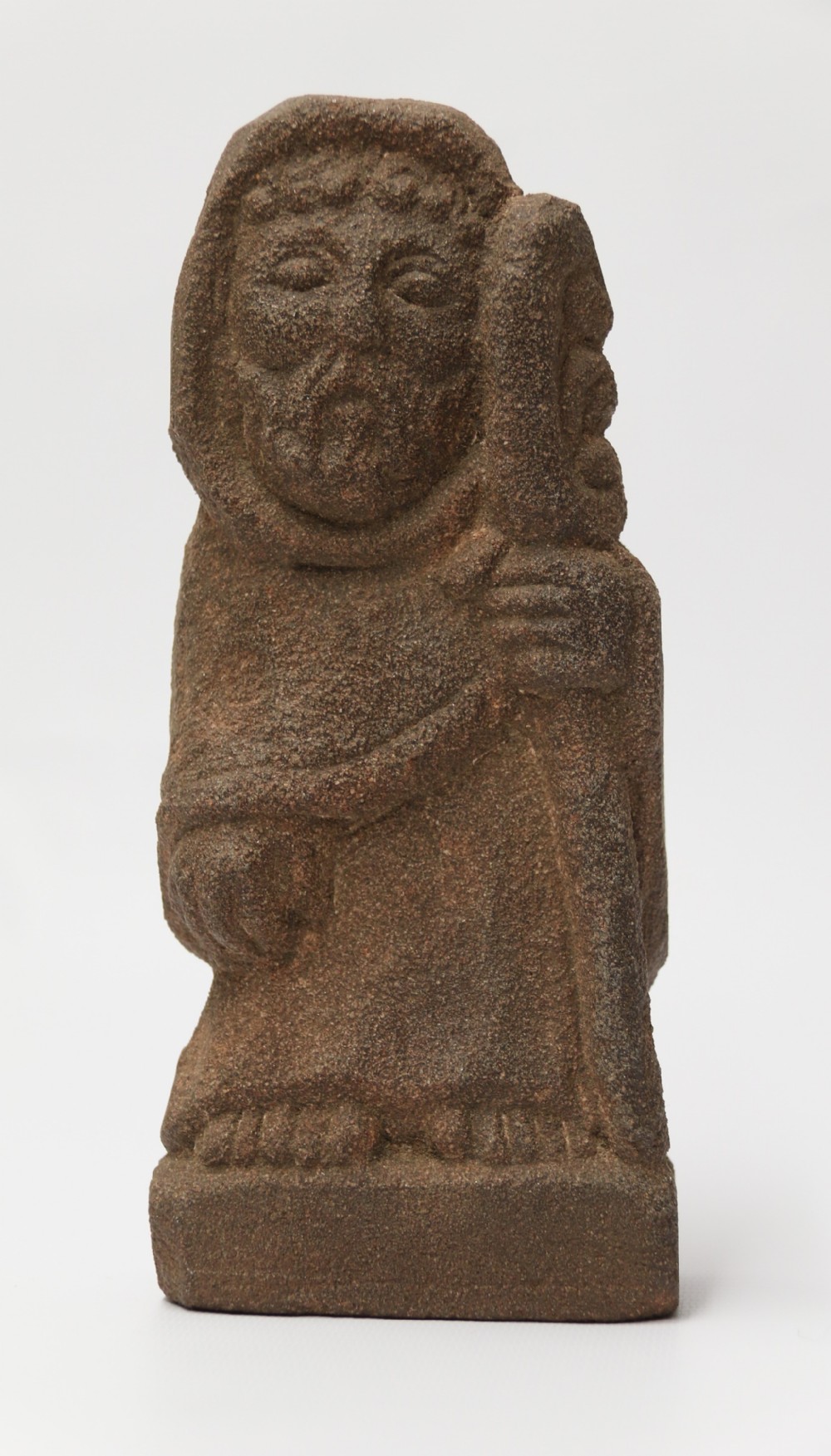 A primitive carved sandstone Celtic style figure, circa 1890