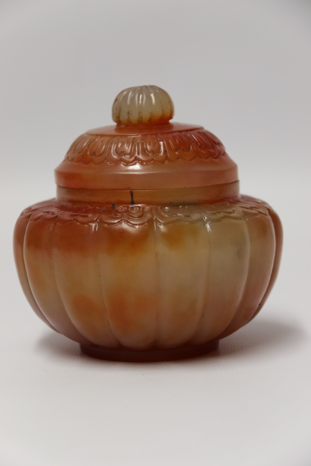 A Chinese hand cut and carved solid agate jar and cover View II