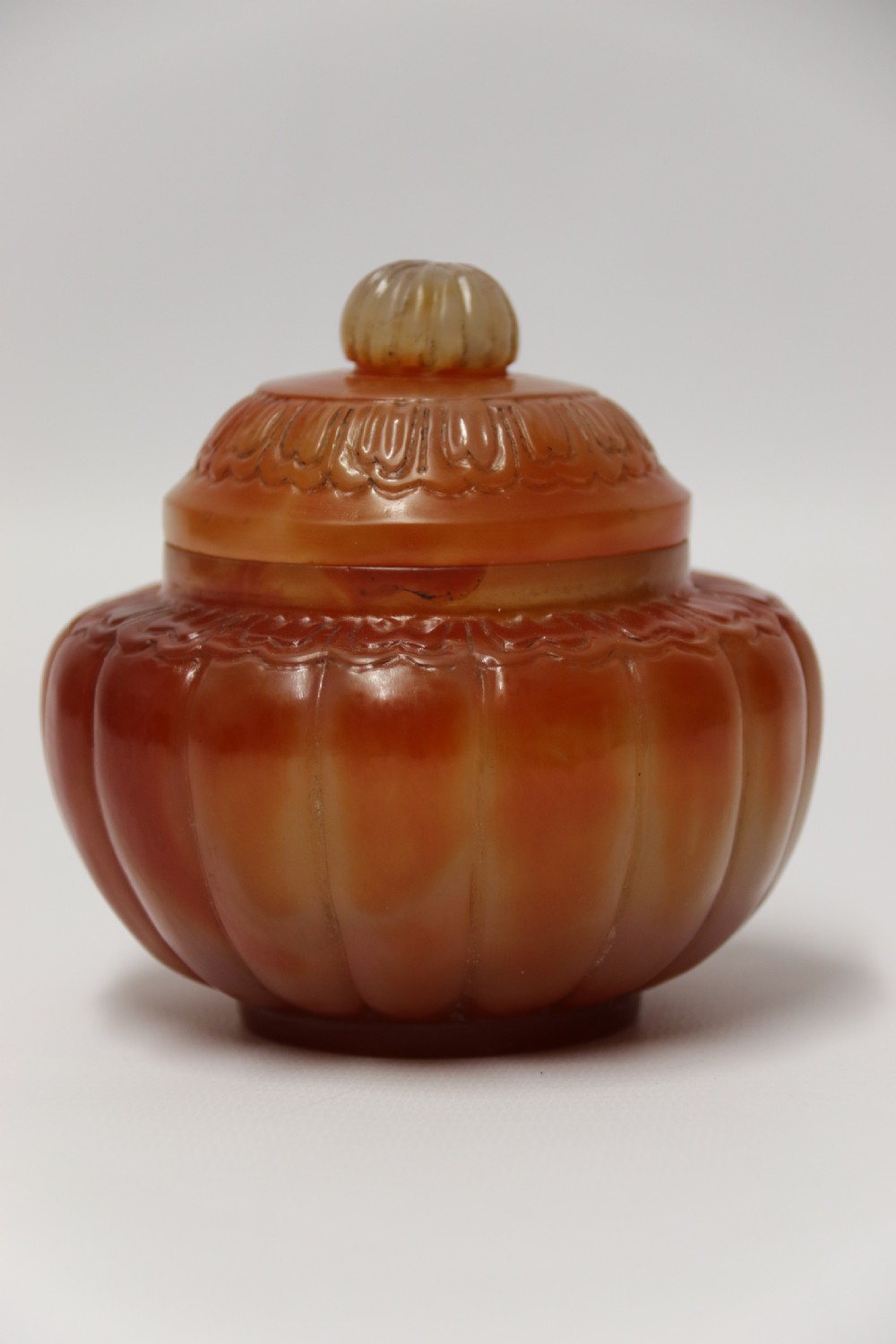 A Chinese hand cut and carved solid agate jar and cover View V