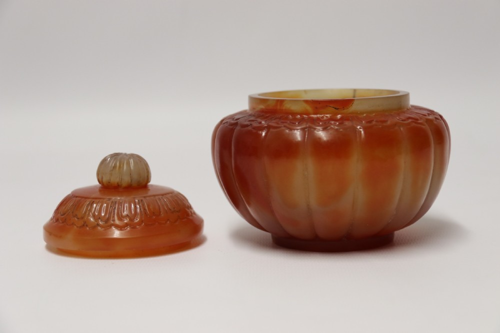 A Chinese hand cut and carved solid agate jar and cover View VI