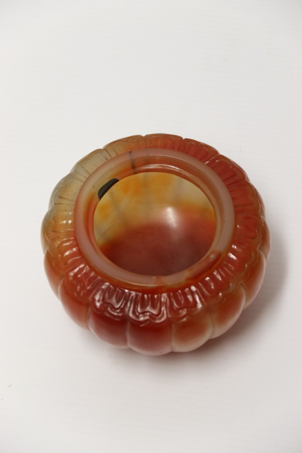 A Chinese hand cut and carved solid agate jar and cover View X