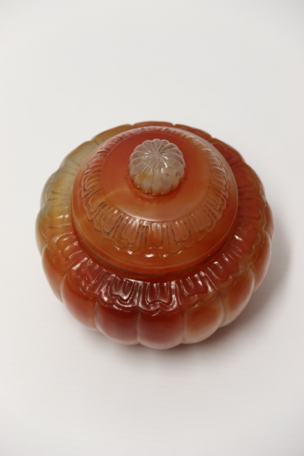 A Chinese hand cut and carved solid agate jar and cover View XI