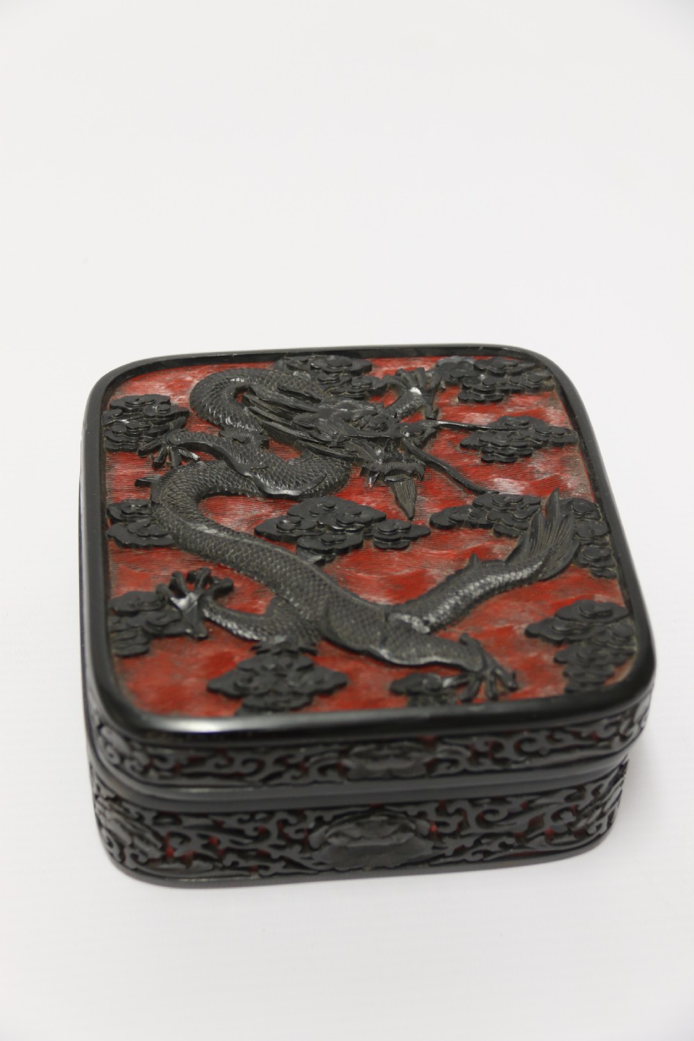 A fine quality 19th century Chinese carved red and black lacquer box View II