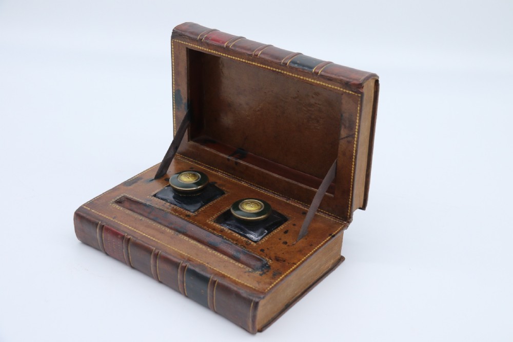 A rare 19th century desk pen and inkstand made in the form of two leather bound books. View V