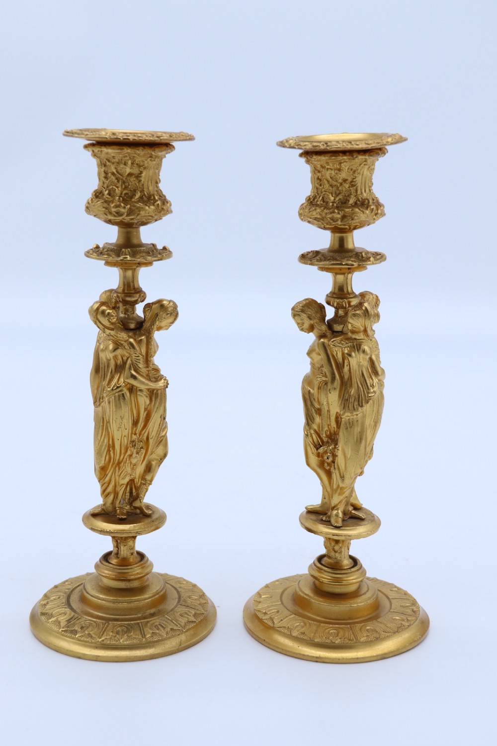 A superb pair of 19th century classical gilt bronze candlesticks. View IV