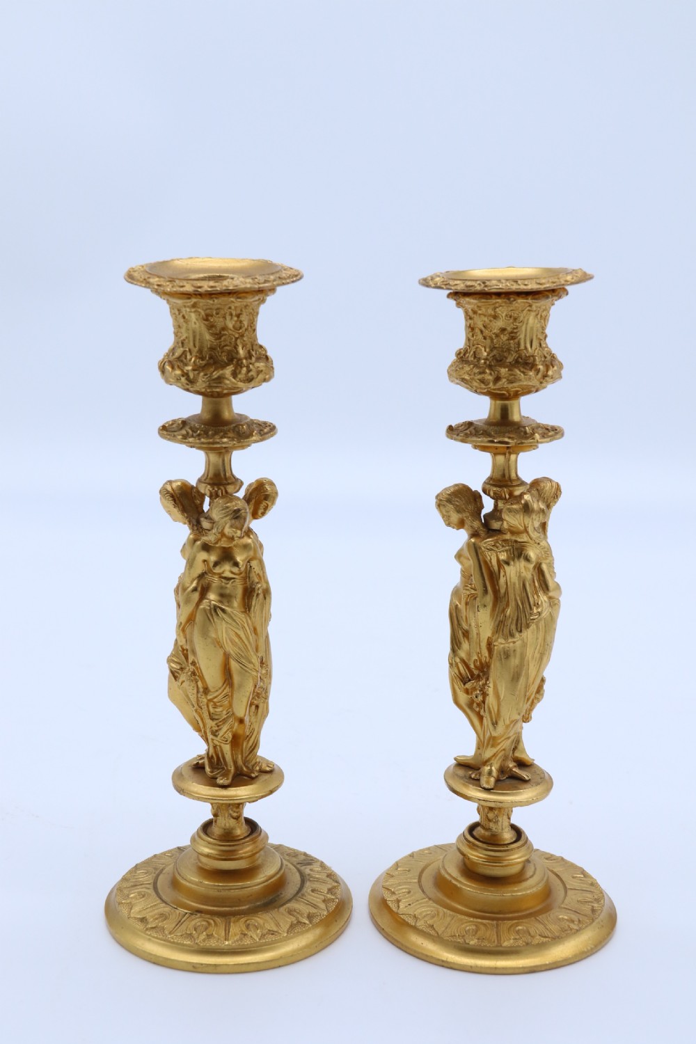 A superb pair of 19th century classical gilt bronze candlesticks. View V