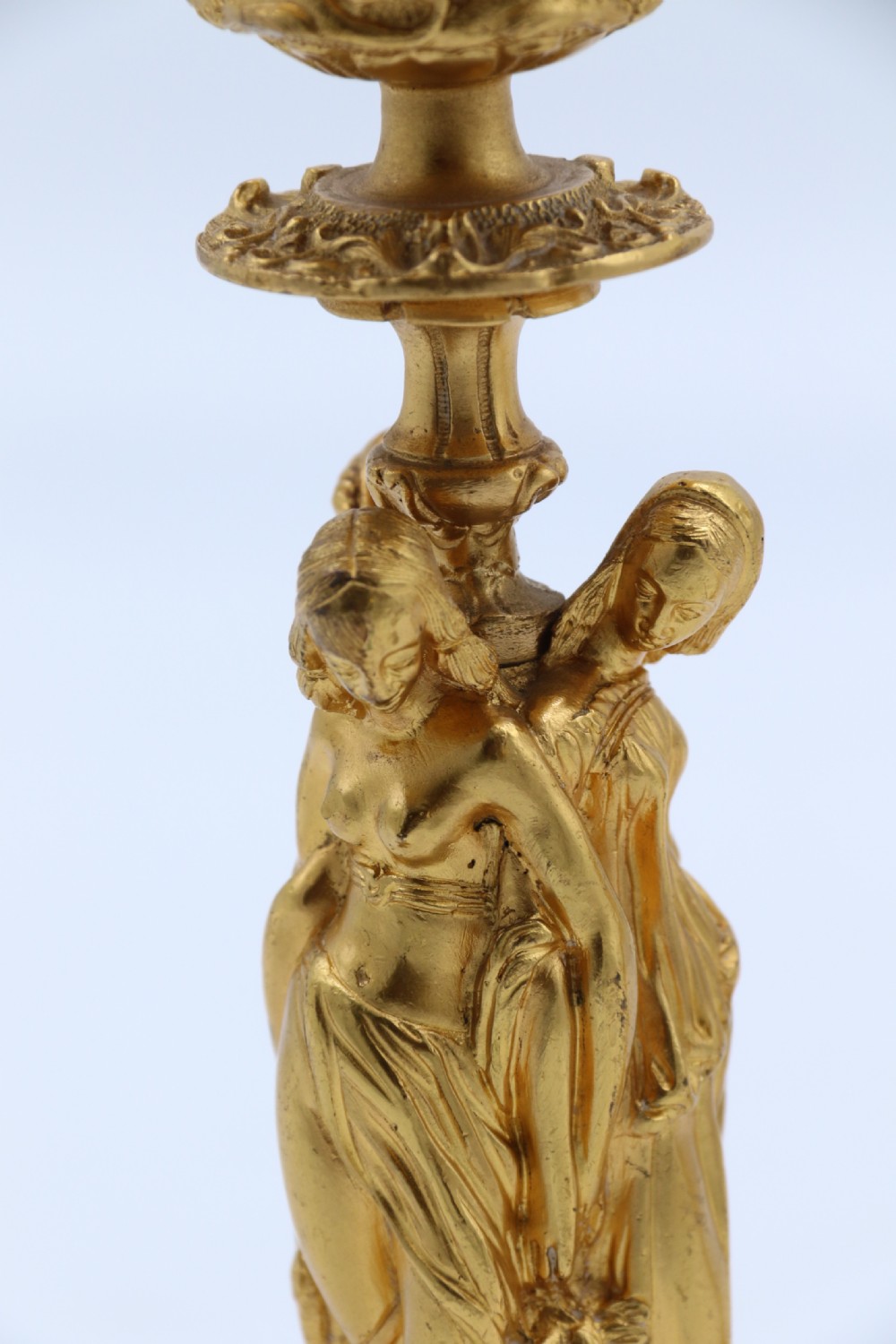 A superb pair of 19th century classical gilt bronze candlesticks. View IX