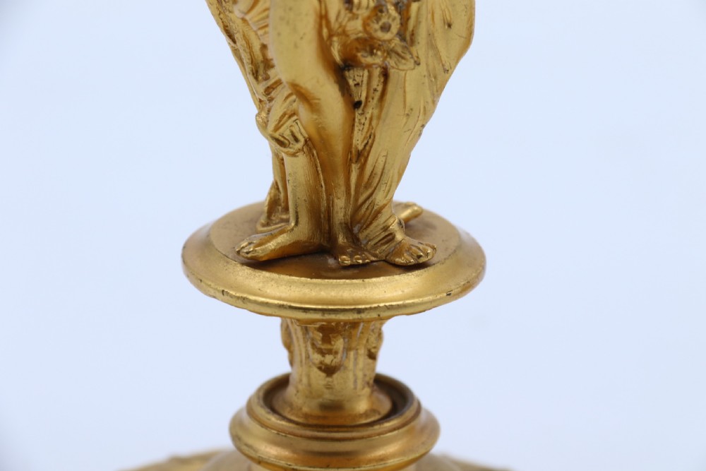 A superb pair of 19th century classical gilt bronze candlesticks. View X