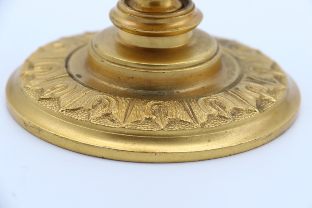 A superb pair of 19th century classical gilt bronze candlesticks. View XI