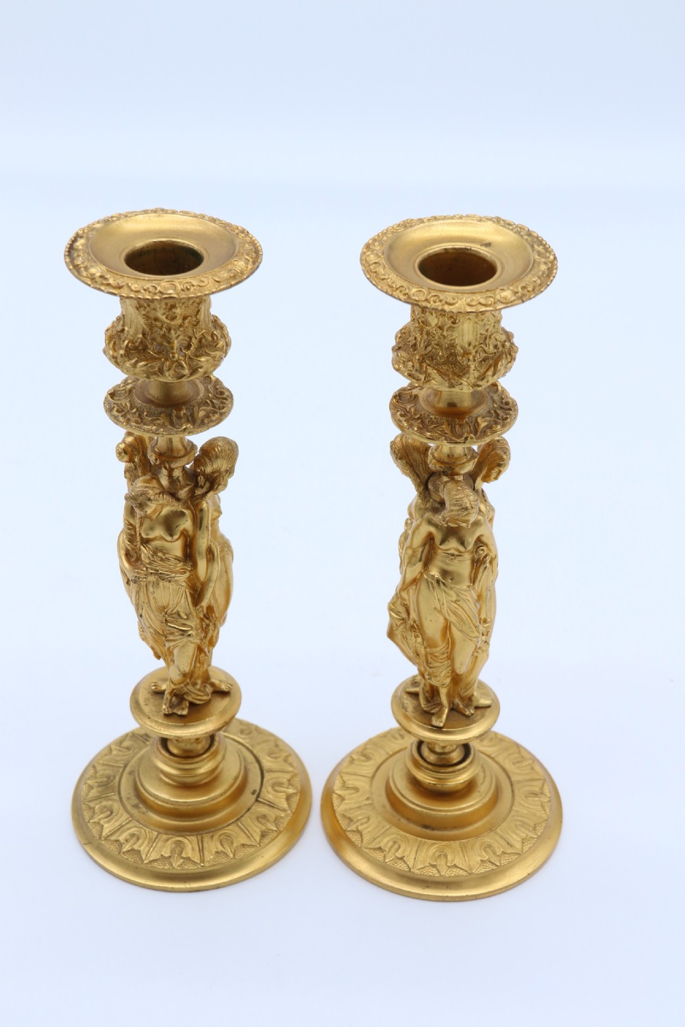 A superb pair of 19th century classical gilt bronze candlesticks. View XV
