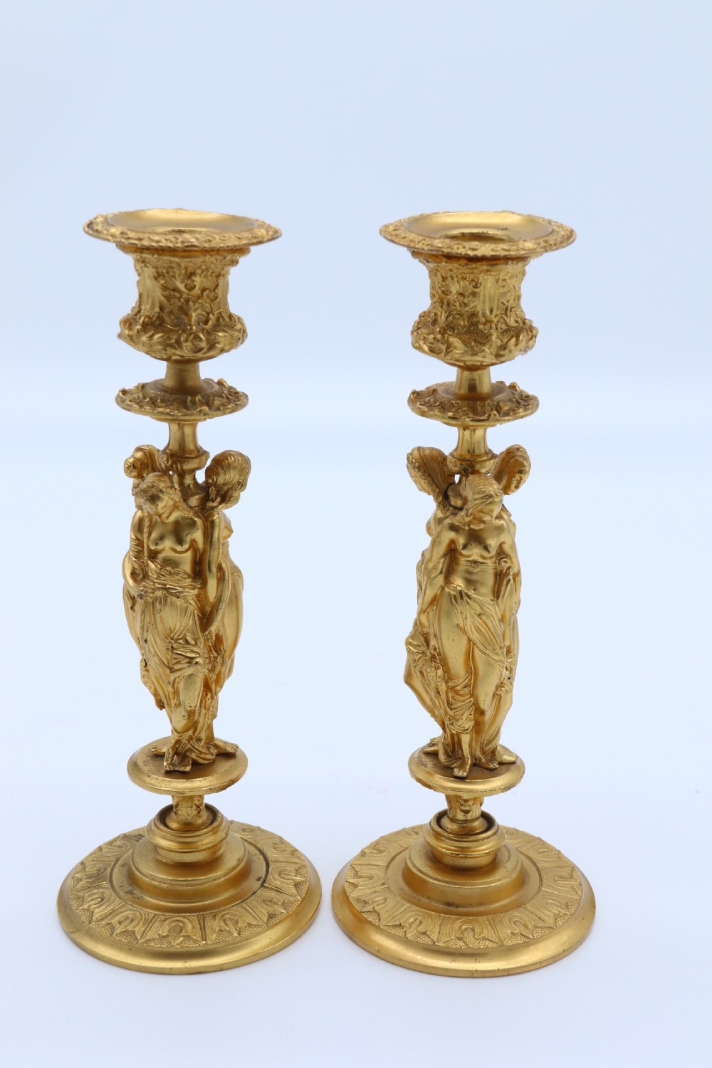 A superb pair of 19th century classical gilt bronze candlesticks. View XVI