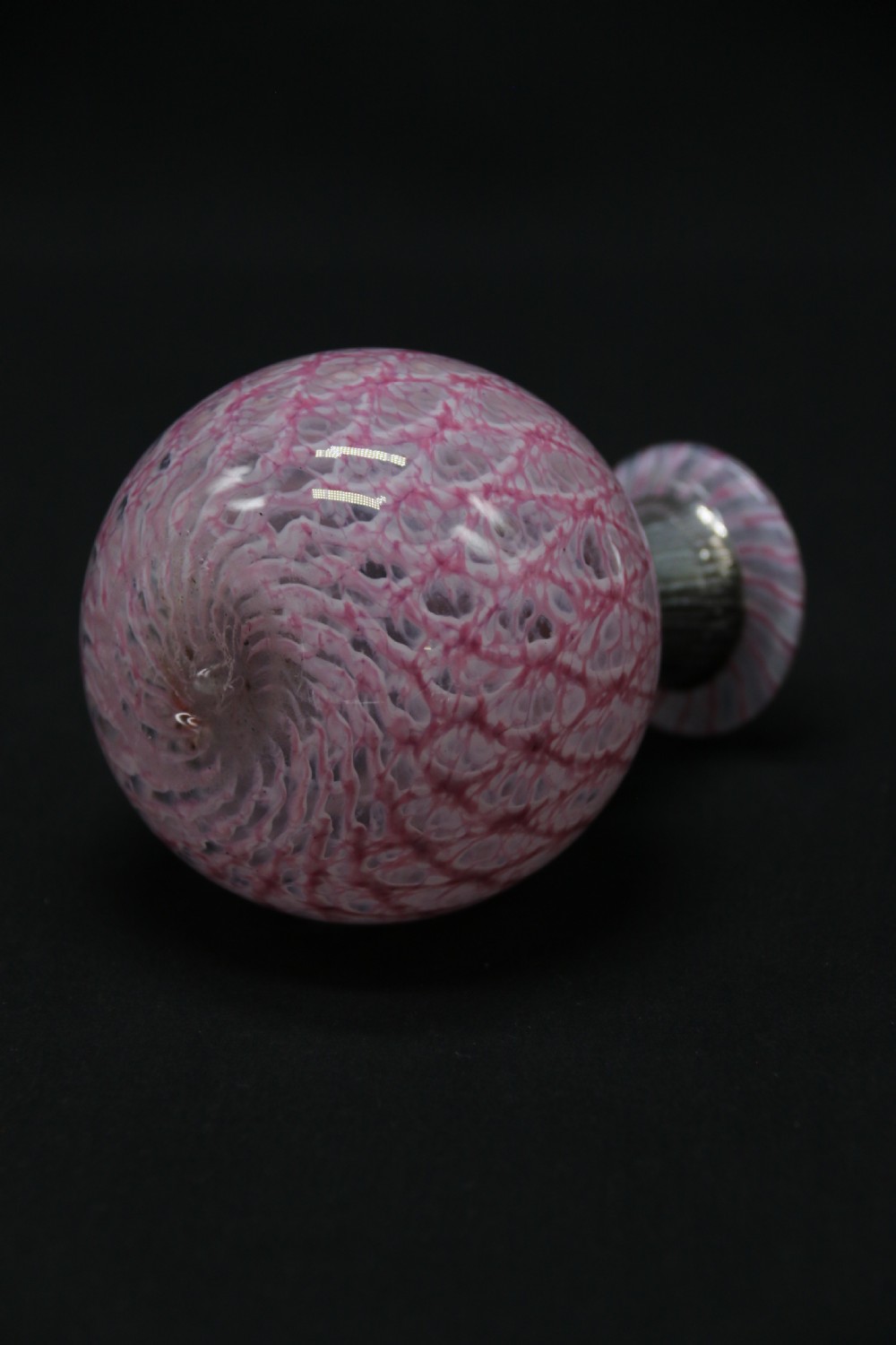 A most unusual 1930s art glass and silver mounted perfume bottle. View III