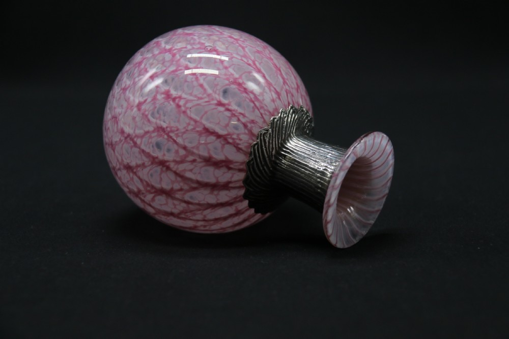 A most unusual 1930s art glass and silver mounted perfume bottle. View V
