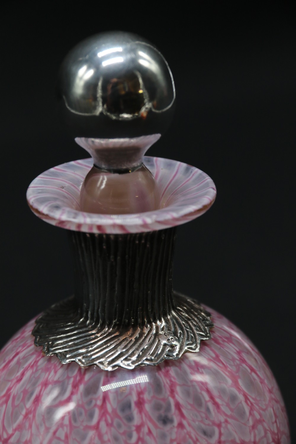 A most unusual 1930s art glass and silver mounted perfume bottle. View IX