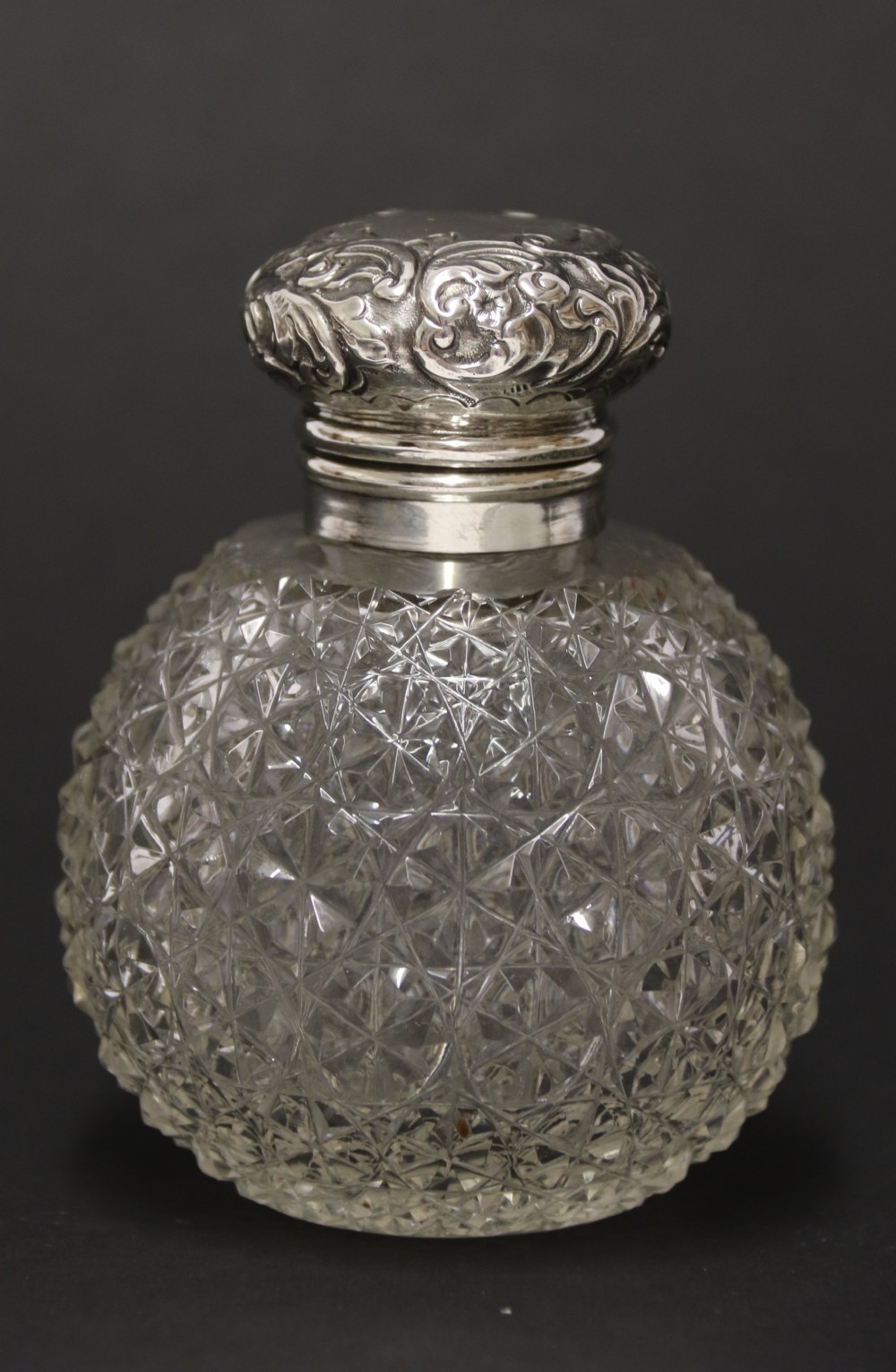 A good quality Victorian silver and cut glass perfume bottle 