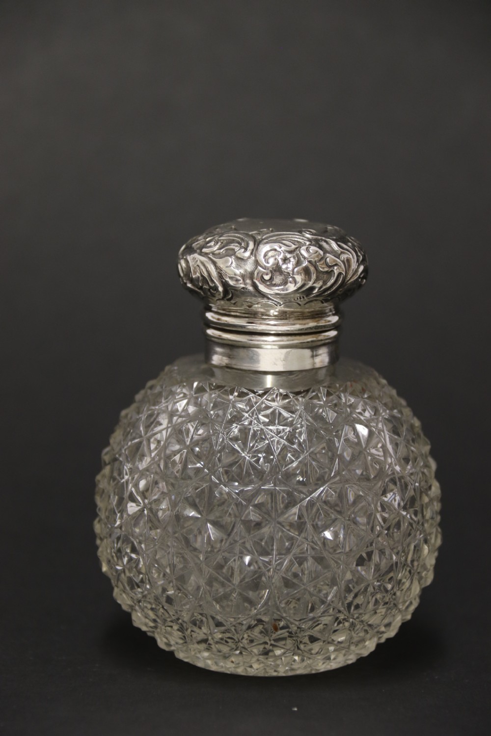 A good quality Victorian silver and cut glass perfume bottle  View V