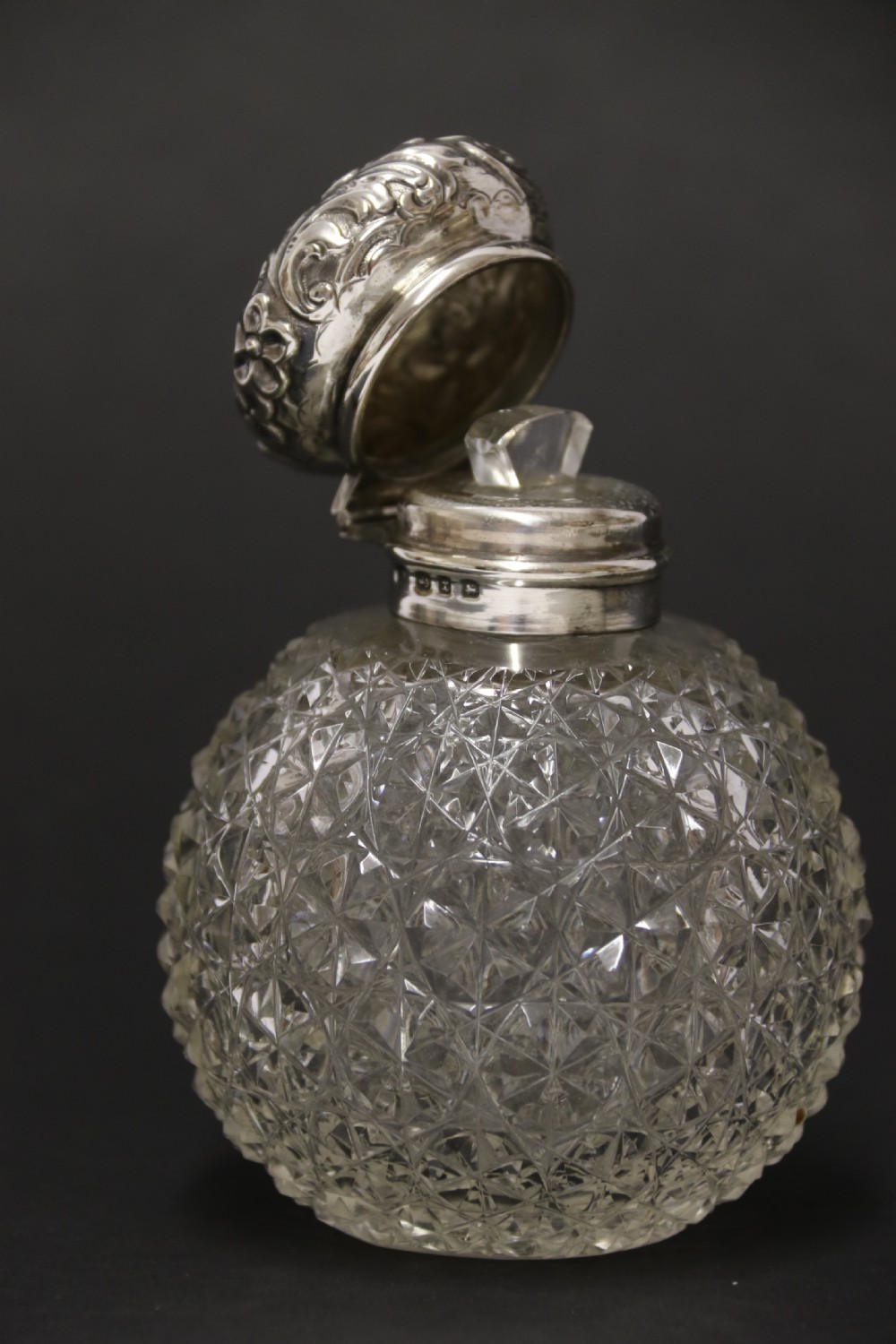 A good quality Victorian silver and cut glass perfume bottle  View VI