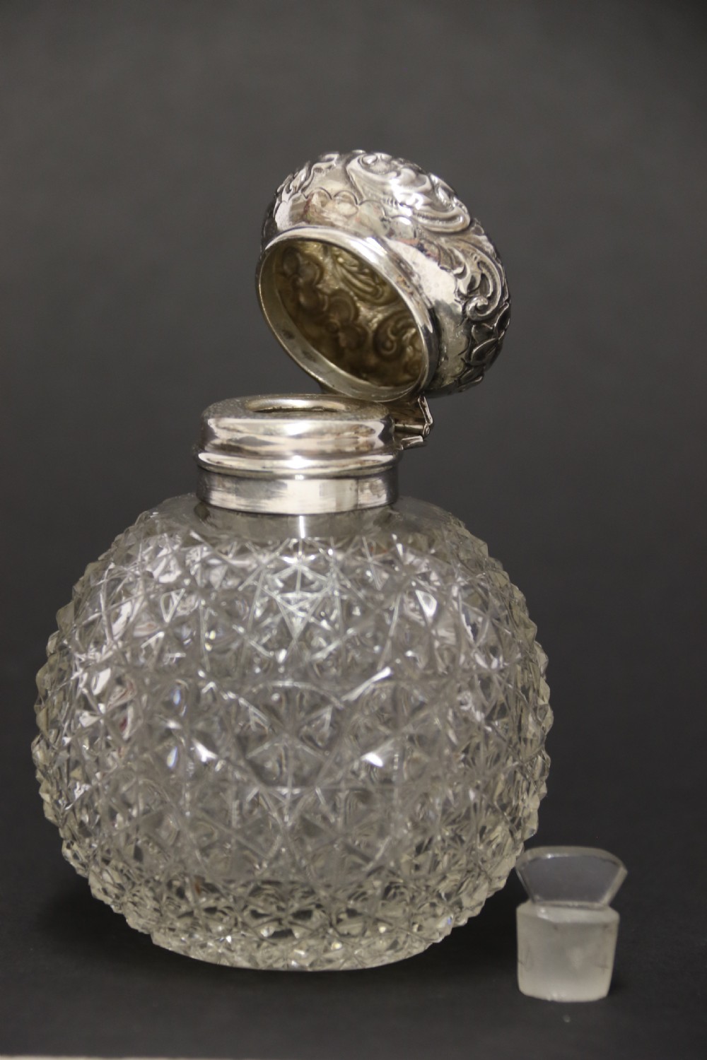 A good quality Victorian silver and cut glass perfume bottle  View VIII