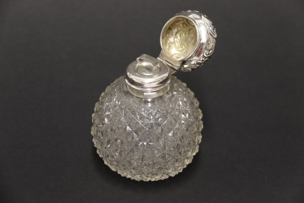 A good quality Victorian silver and cut glass perfume bottle  View IX