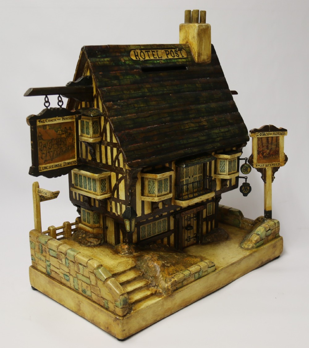 A rare folk art hotel post box in the form of a half timbered inn