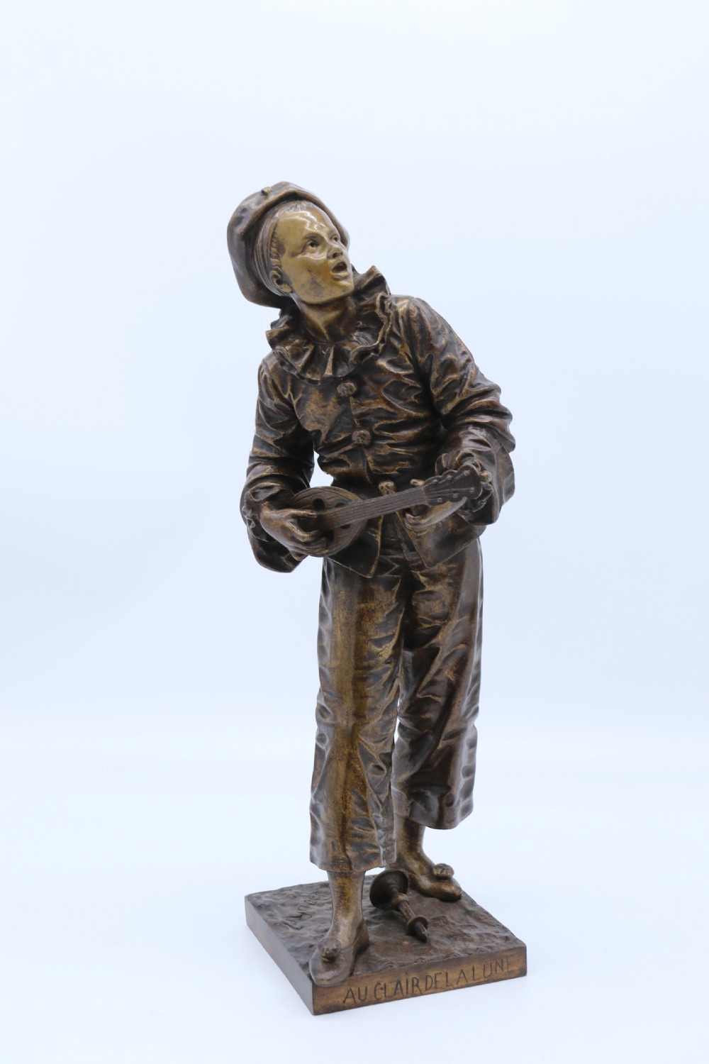 A fine French Bronze sculpture of a Pierrot singing and playing the lute by Bornet. 